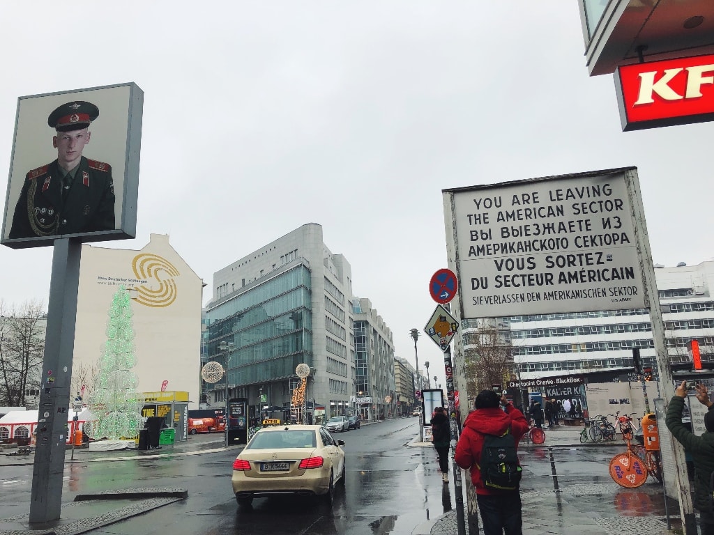 Checkpoint Charlie sign post with 4 different languages